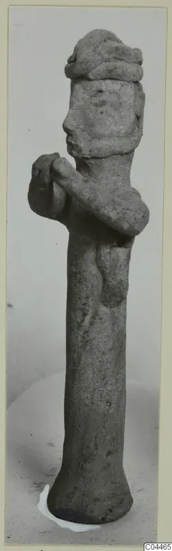 Terracotta figurine of a standing figure with hands raised to the chest, from Ayia Irini