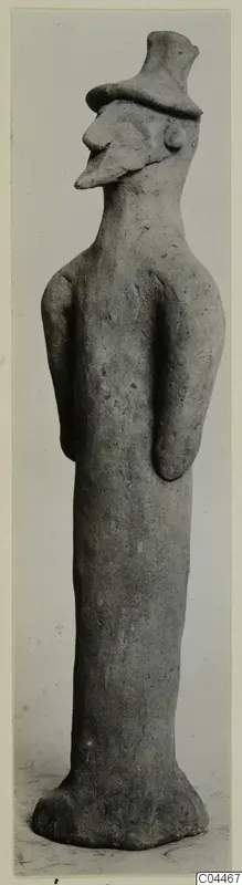 Terracotta figure of a standing figure with a tall flat-topped headdress, from Ayia Irini
