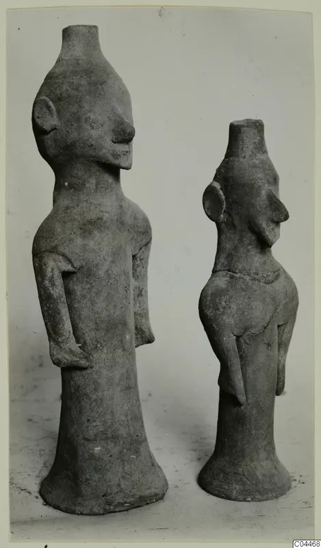 Two terracotta figurines of standing figures with cylindrical tops and flared bases, Terracotta Minor Plastic 3