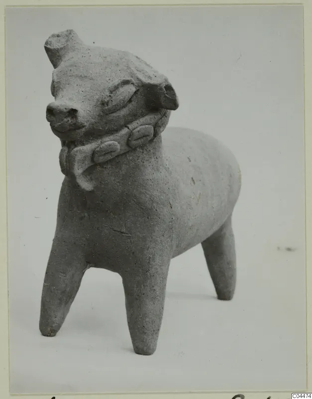 Terracotta figurine of a standing four-legged animal with a band around its neck, photographed against a pale background