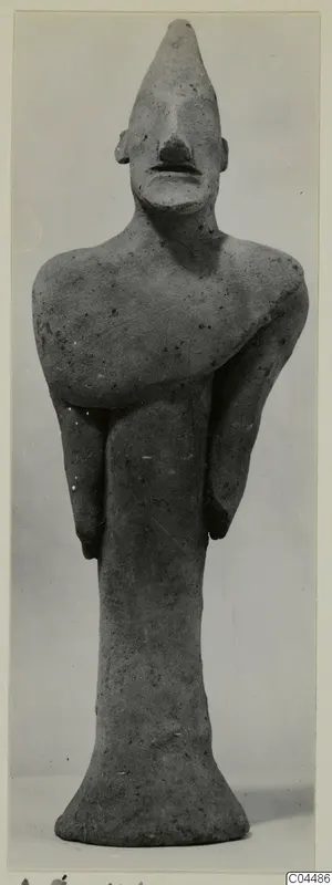 Terracotta figurine of a standing figure with arms folded across the chest, from Ayia Irini