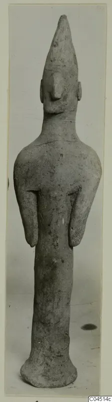 Terracotta figurine of a standing figure with a tall pointed head, from Ayia Irini