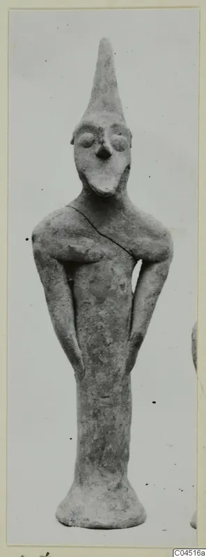 Terracotta Minor Plastic 3: standing terracotta figurine with a tall pointed head and flared base