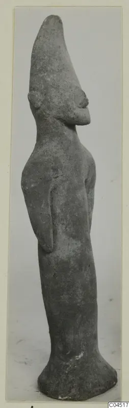 Terracotta figurine of a standing human figure with a tall pointed head, from Ayia Irini