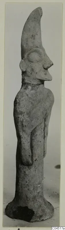 Terracotta figurine with a tall curved crest and flared base, from Ayia Irini