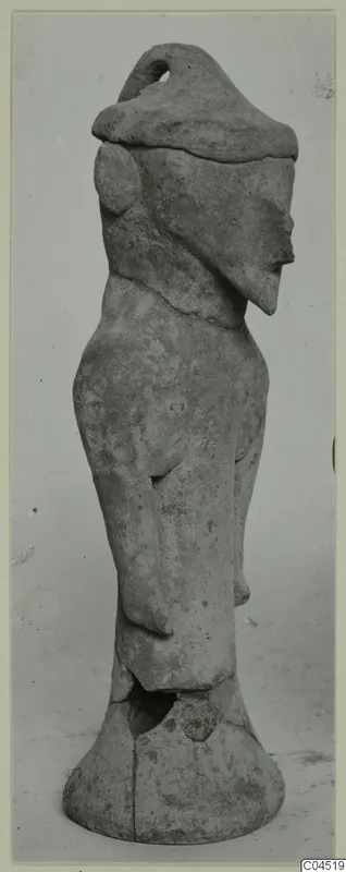 Terracotta figurine of a standing figure with a tall cap-like headdress, from Ayia Irini