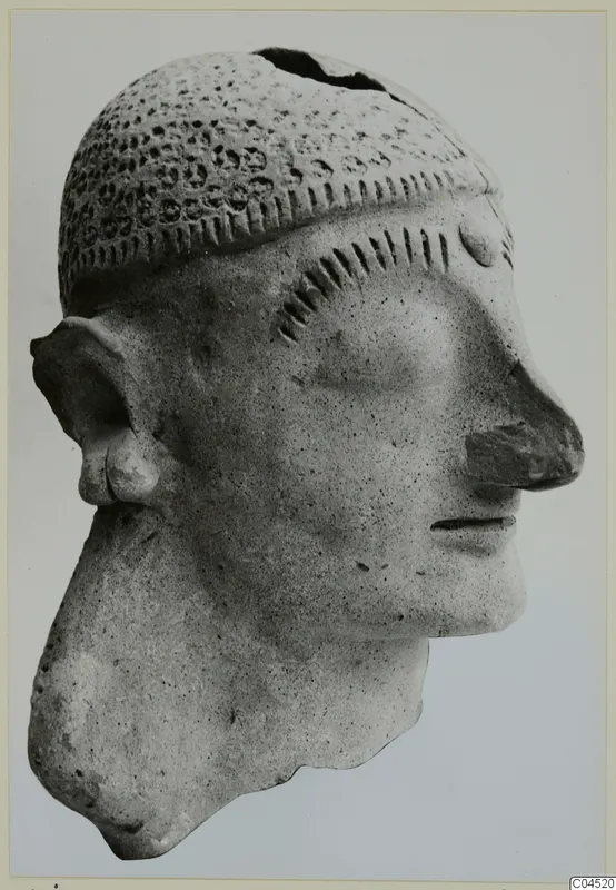 Terracotta head of a figure from Ayia Irini, shown in profile against a plain background