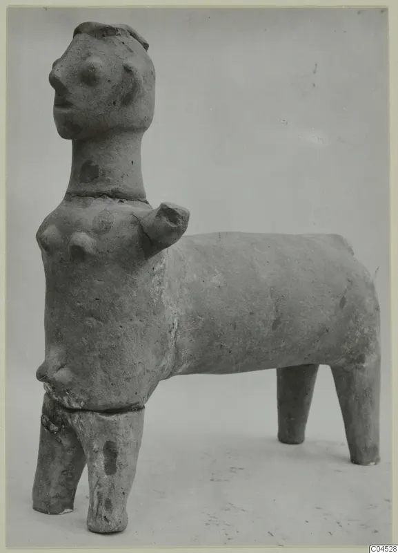 Terracotta figurine from Ayia Irini with a human-like head and breasts on a four-legged, animal-like body
