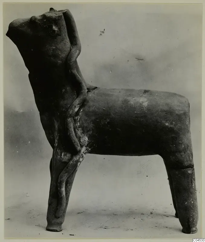 Terracotta statuette of a four-legged animal with a tubular form applied along its side, from Ayia Irini