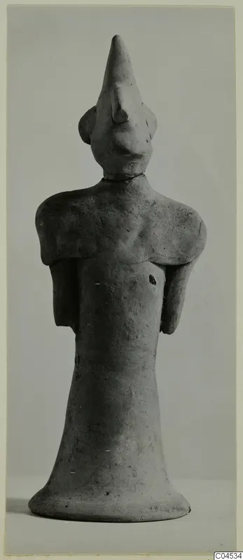 Terracotta figurine of a standing figure with a tall pointed head, from Ayia Irini
