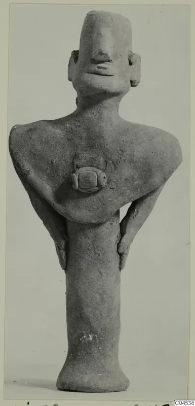 Terracotta figurine of a standing human figure with a tall, flat-topped head and a flared base