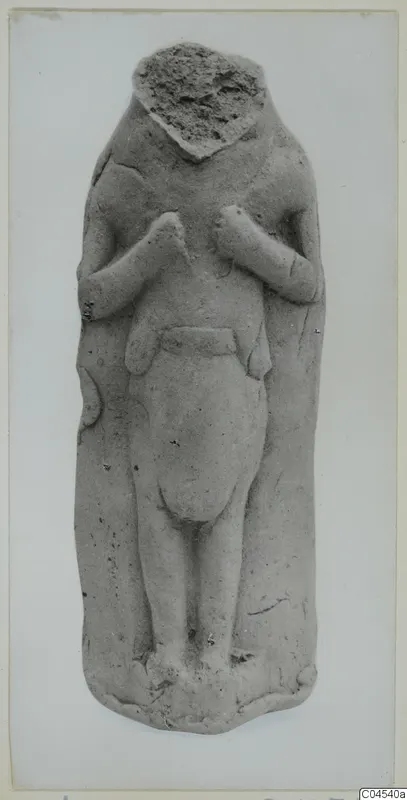 Terracotta figurine of a standing figure with its head broken off and hands raised to the chest