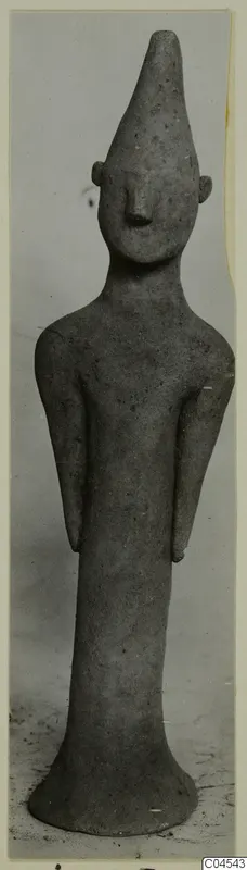 Terracotta figurine from Ayia Irini: a standing human figure with a tall pointed head and long body