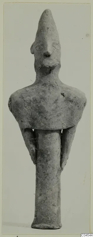 Terracotta figurine of a standing human figure with a tall conical head, from Ayia Irini