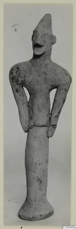 Terracotta figurine of a standing human figure with arms bent at the waist, from Ayia Irini