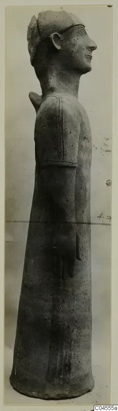 Terracotta Proto-Cypriote II, a tall standing figure seen in profile facing right