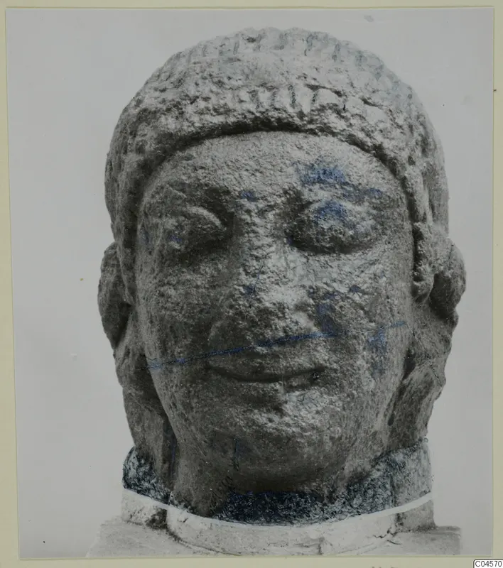 Limestone head of a sculpture from Arsos, face forward, with a band across the top of the head.
