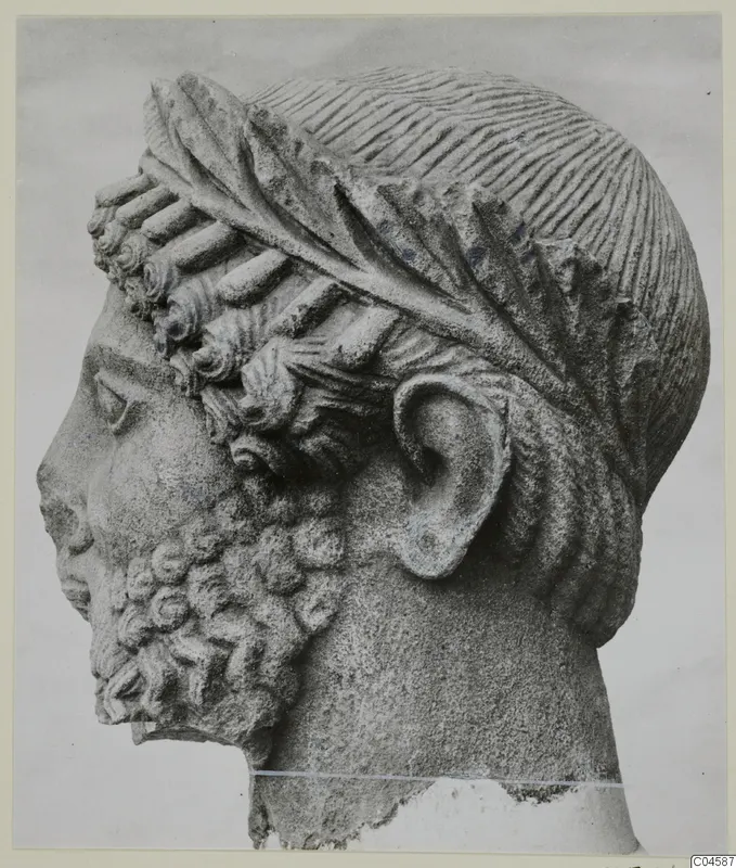 Limestone sculpture of a bearded head in profile, from Arsos