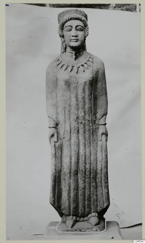Limestone statue of a standing figure from Arsos, Cypro-Greek II, photographed against a pale backdrop