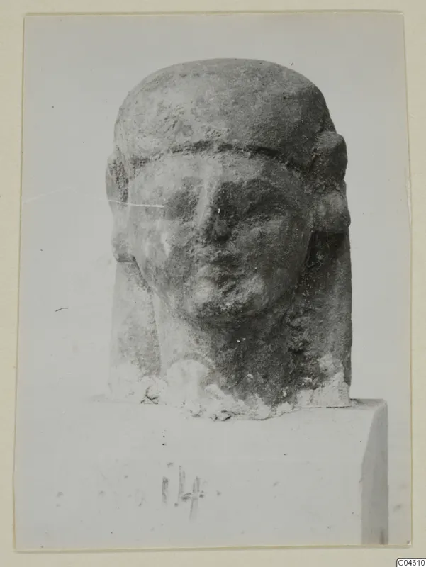 Limestone Neo-Cypriote head sculpture on a rectangular block base, shown from the front