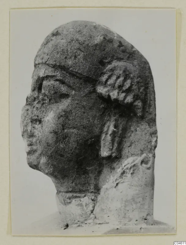 Limestone sculpture head, labelled Proto-Cypriote, shown in three-quarter view
