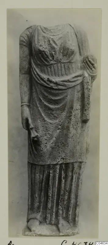 Stone statue of a standing draped figure, headless, from Arsos