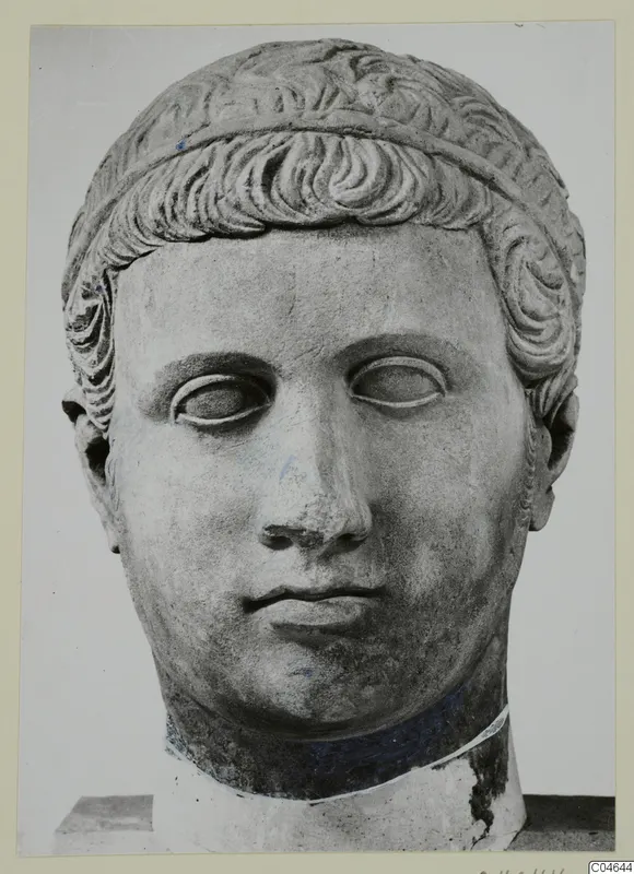 Stone statue head from Arsos, front view, with short wavy hair bound by a band