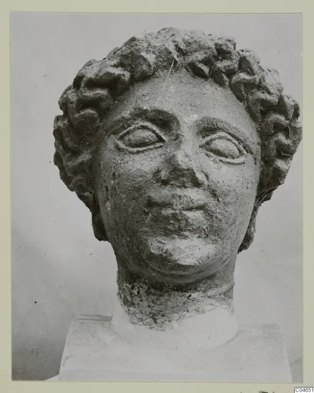 Stone statue head with curled hair, Arsos VIII-IX