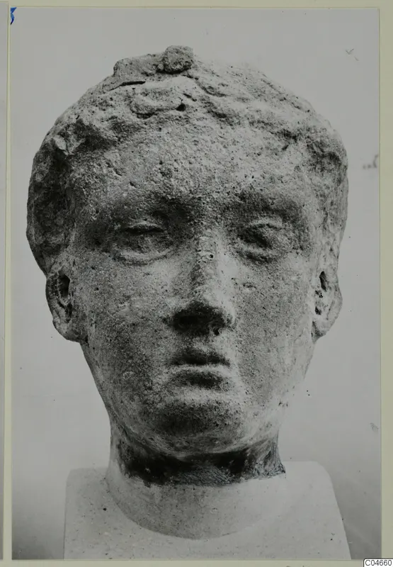 Sculpted head from Mersinaki, shown from the front on a plain square base