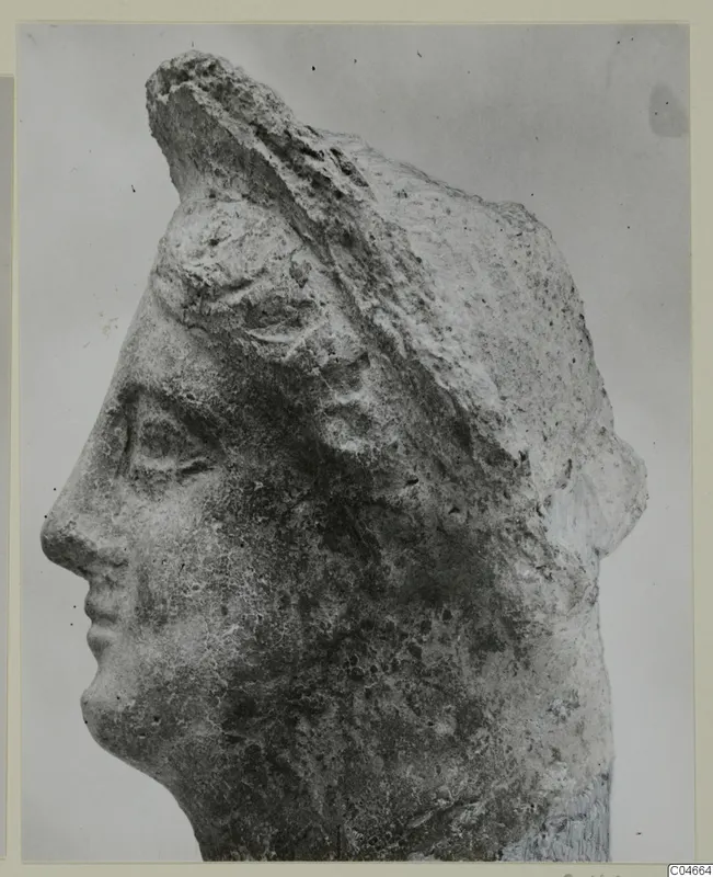 Stone head in left profile with a raised headdress, from Mersinaki