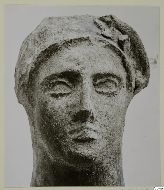 Limestone head from Mersinaki with a close view of the face and headdress