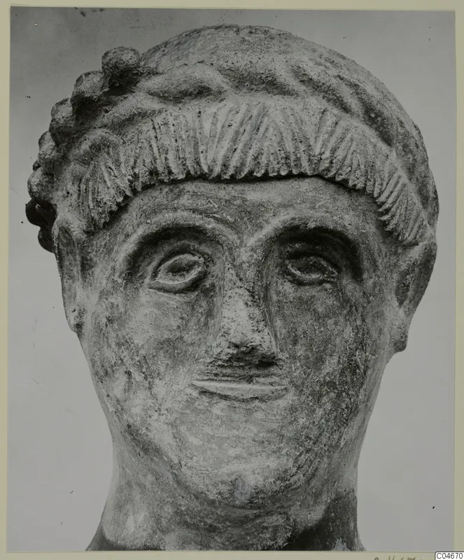Head from Mersinaki, front view, with incised hair fringe and curled locks above the forehead