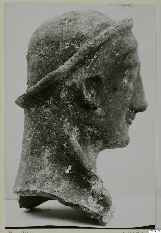 Terracotta head of a figure in profile, wearing a band or veil over the head, from Mersinaki.