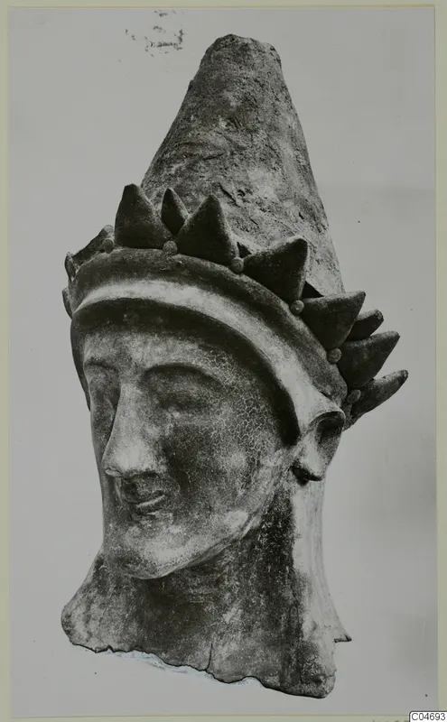 Head of a figure with a tall conical headdress, from Mersinaki
