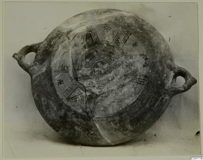 Pottery Black Slip Bichrome vessel with two loop handles, seen from above, with painted concentric circles and radiating bands
