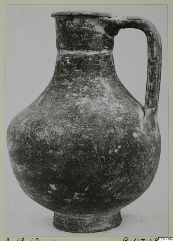 Single-handled jug from the Amathus tombs, shown in front view against a plain background.