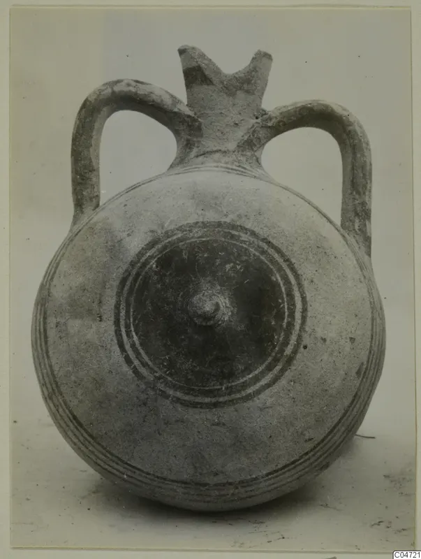 Pottery Bichrome III vessel with two loop handles, a round body and concentric ring decoration around a central boss