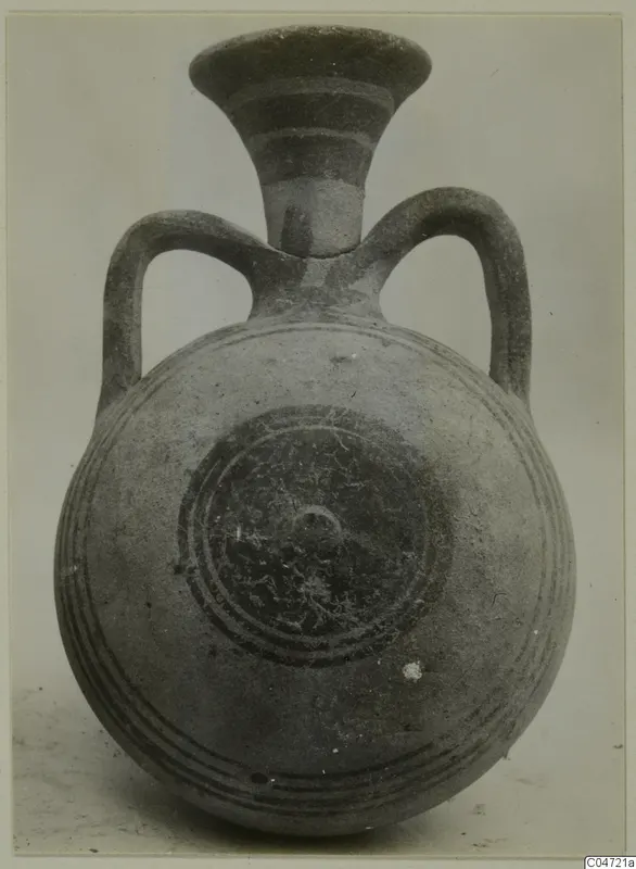 Pottery Bichrome III vessel from Amathus with a round body, flaring neck and two loop handles