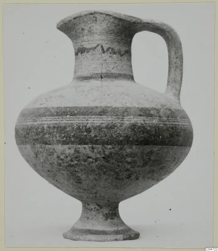 Pottery White Painted I-II jug from Amathus with a wavy painted band on the neck and a single strap handle