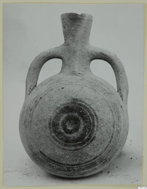 Pottery White Painted II vessel with two loop handles and dark concentric circles painted on the body