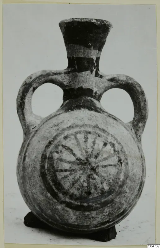 Pottery White Painted II vessel from Amathus with two loop handles and a radiating wheel motif on the body