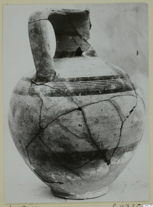 White Painted I jug from Amathus with a strap handle and dark painted bands around the body