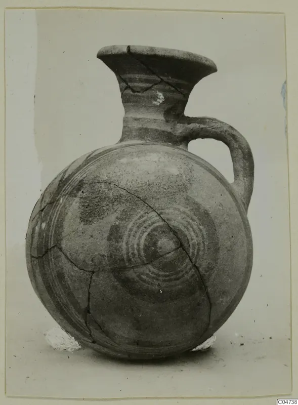 Pottery White Painted II jug from Amathus with a round body, painted concentric circles and visible cracks