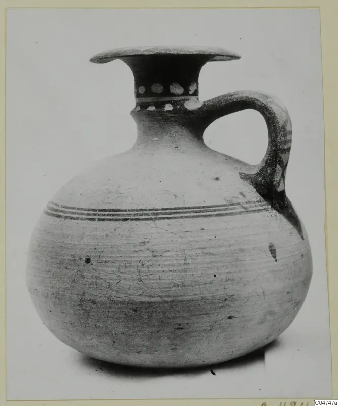 Pottery Bichrome IV jug from Amathus with flaring rim, single loop handle and dark painted bands