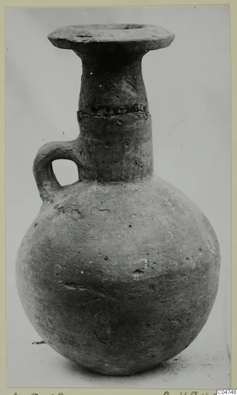 Pottery jug with a globular body, flared rim and single loop handle, from Amathus tombs