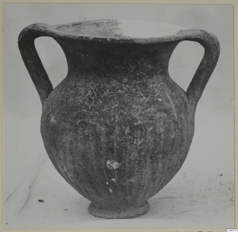 Two-handled Black Slip I-VI vessel from Amathus, photographed on a pale background