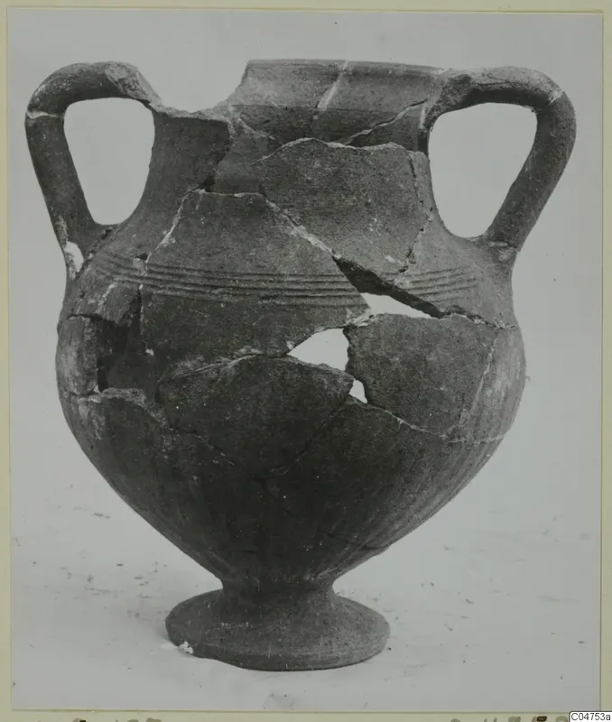 Two-handled Black Slip jar from Amathus, broken and partly reassembled, with grooved bands around its shoulder