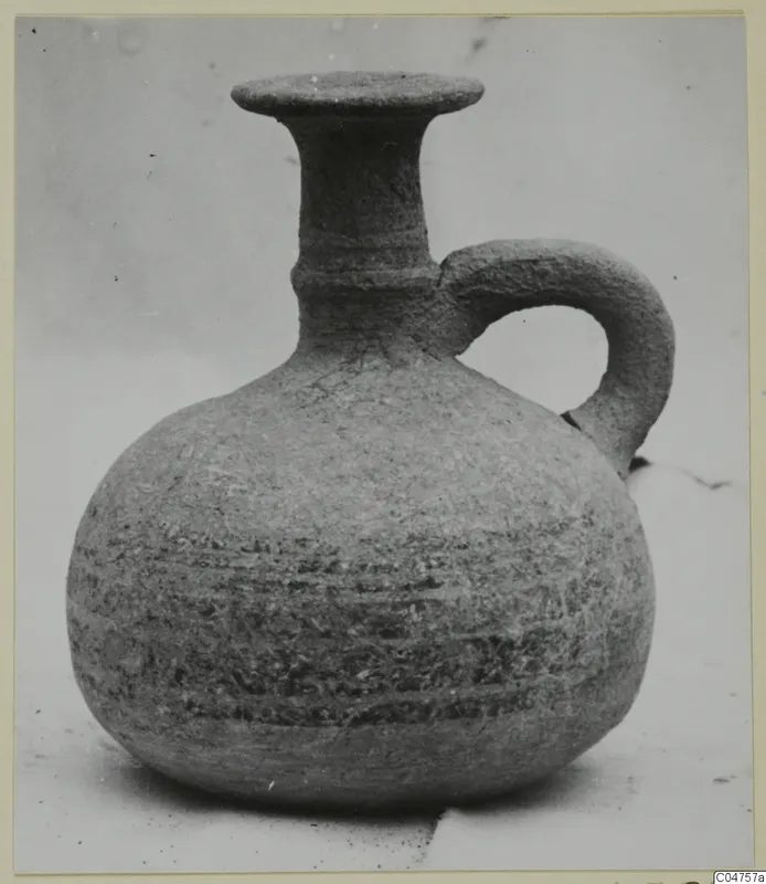Single-handled jug with a round body, flared mouth and dark horizontal bands, from Amathus
