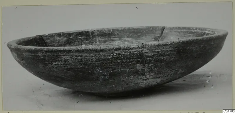 Wide, shallow pottery bowl from Amathus with a rounded body and rim, photographed at an angle on a pale background.