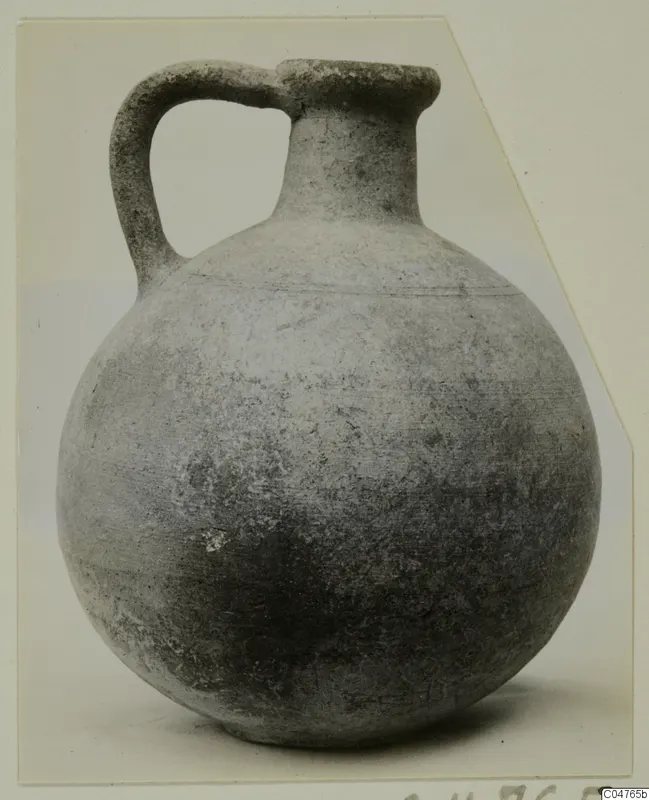 Pottery Plain White IV-V jug with a strap handle and a rounded body, from Amathus tombs